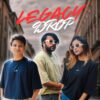 A promotional image featuring three models wearing oversized t-shirts from the "Legacy Drop" collection by Eskape. The models are dressed in Prussian Blue, Goblet Brown, and Raven Black t-shirts, posing in a stylish urban setting.